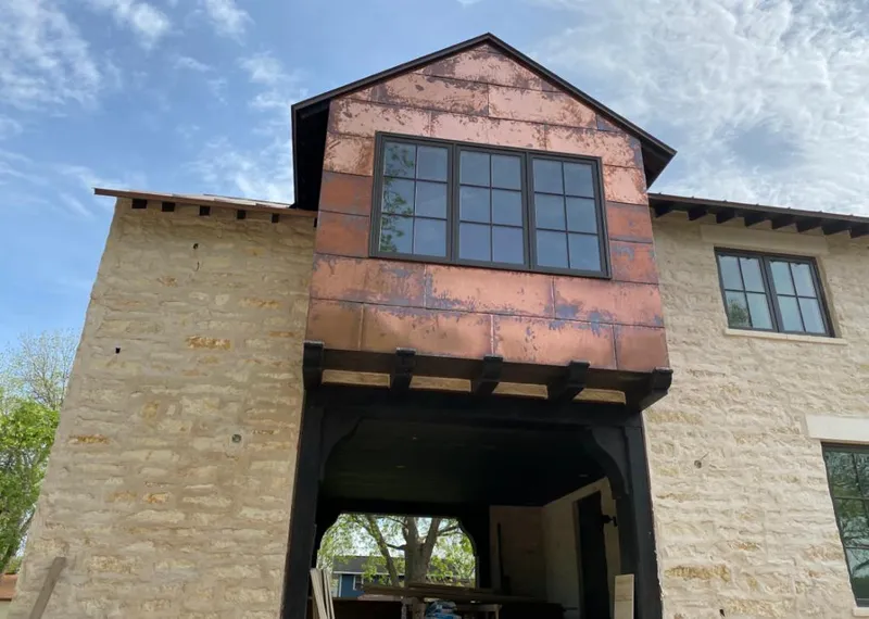 Copper metal panel facade on a stone building for Skylight Installation in Fort Stockton